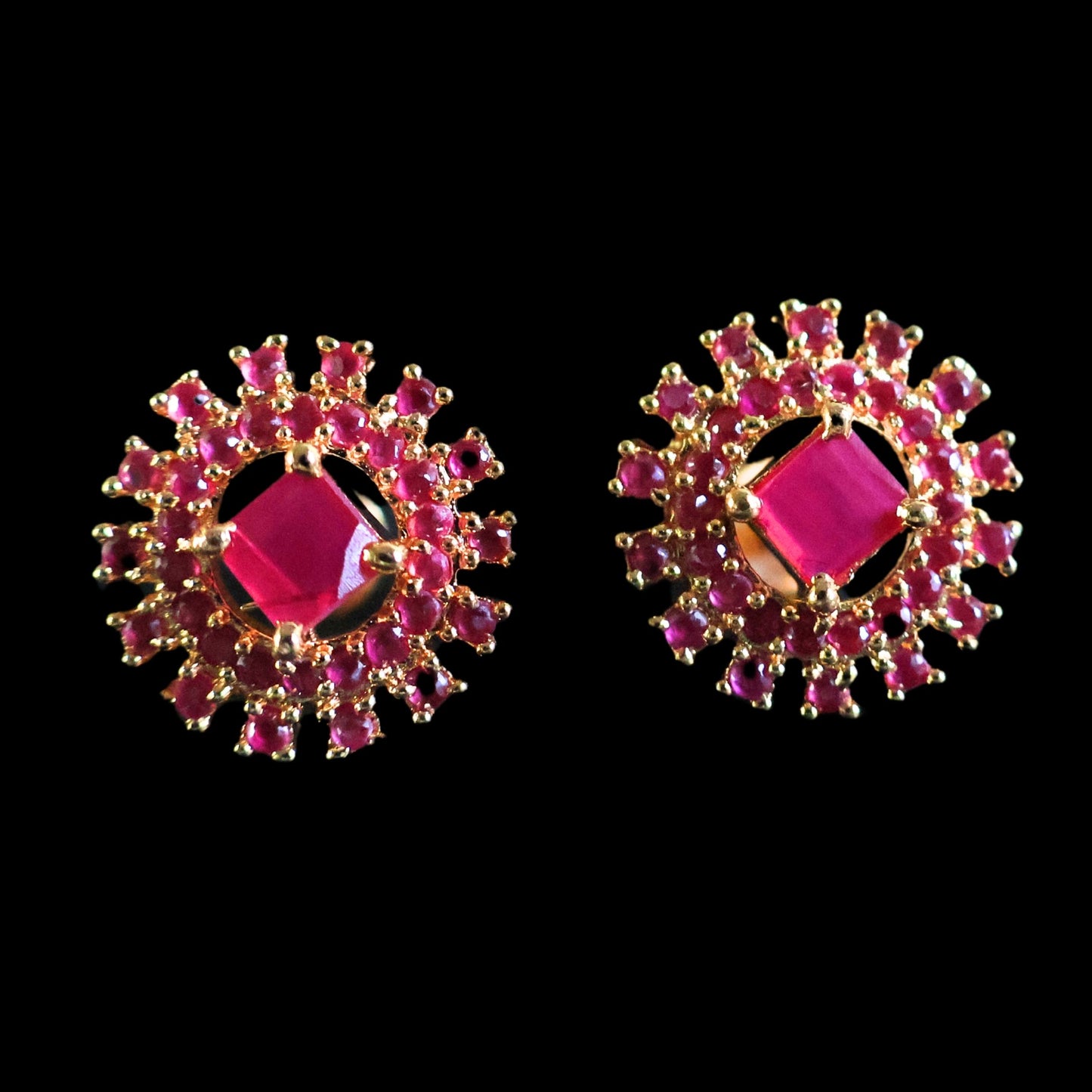 Gold toned red-purple American Diamond Studs